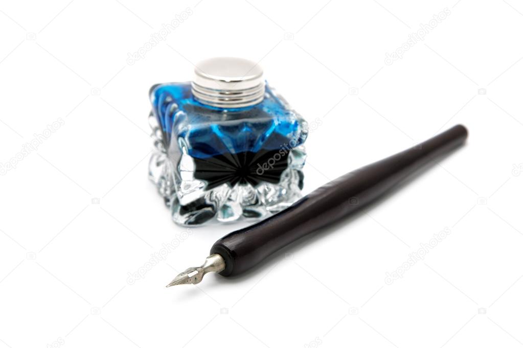 Vintage fountain pen and inkwell isolated on a white background