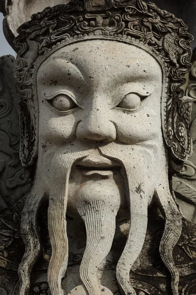 Wat Pho stone guardian face close up, Thailand — Stock Photo, Image