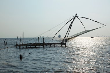 günbatımı üzerinde Çince file çorap. Kochi, kerala, Hindistan