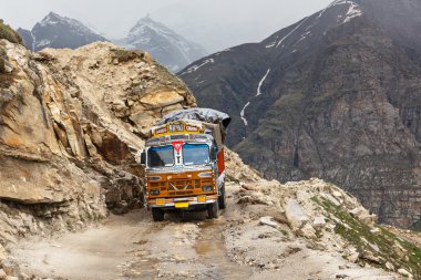 Manali-Leh road in Indian Himalayas with lorry clipart