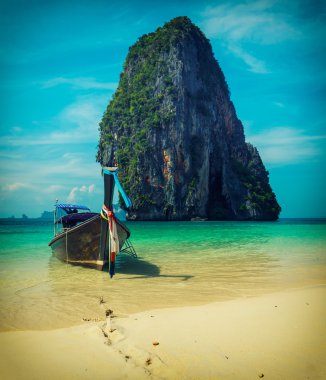 Long tail boat on beach, Thailand clipart