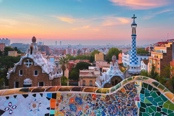 Barcelona city view from Guell Park. Sunrise view of colorful mosaic building in Park Guell — Stock Photo, Image