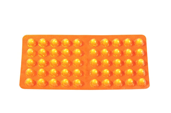 Pakket met gele vitamine tabletten — Stockfoto