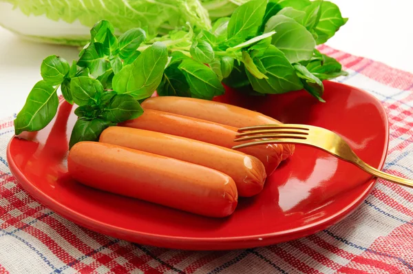 Sausage with green vegetables — Stock Photo, Image