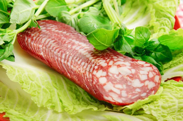 Sausage with basil — Stock Photo, Image