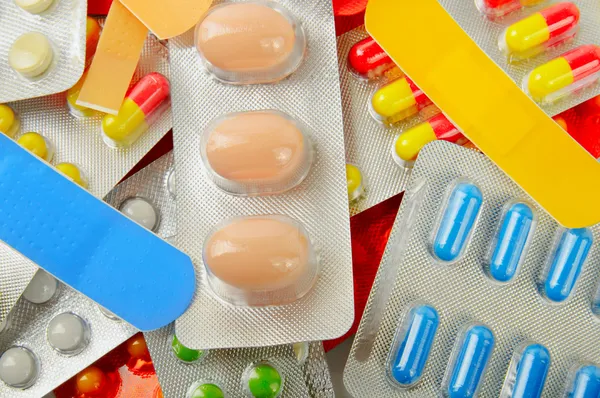 Multicolored medicine pills background — Stok fotoğraf