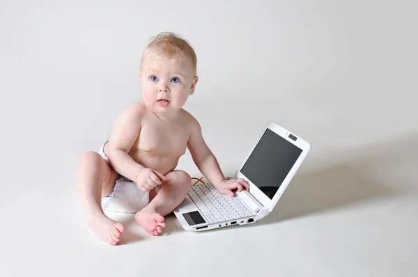 Baby with a laptop — Stock Photo, Image