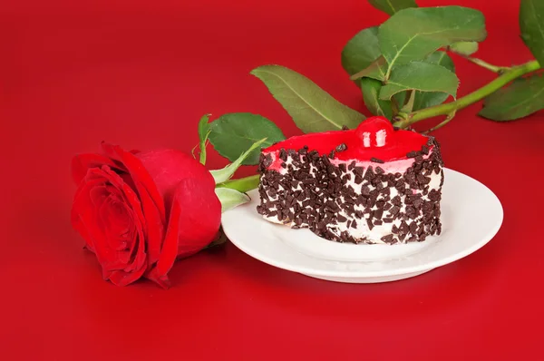 Pink rose and cake — Stock Photo, Image