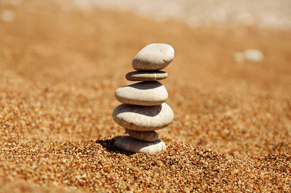 Cairn on the sand — Stock Photo, Image