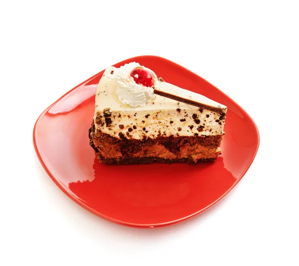Schokoladenkuchen auf rotem Teller — Stockfoto