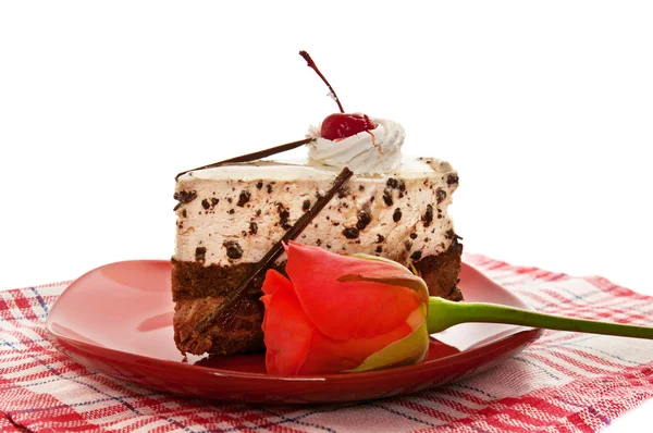 Chocolate cake on red dish — Stock Photo, Image