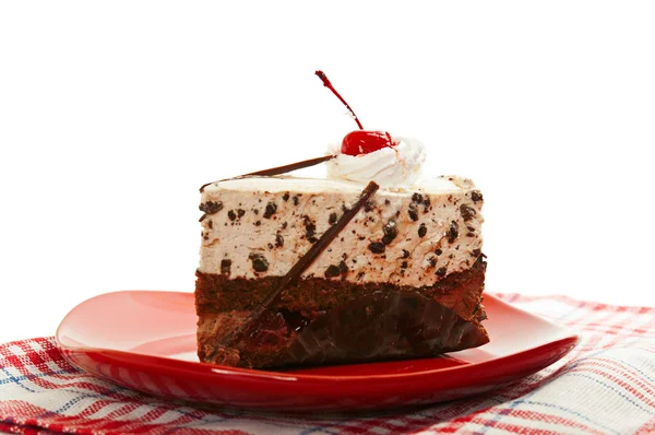 Chocolate cake on red dish — Stock Photo, Image