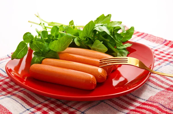 Sausage with green vegetables — Stock Photo, Image