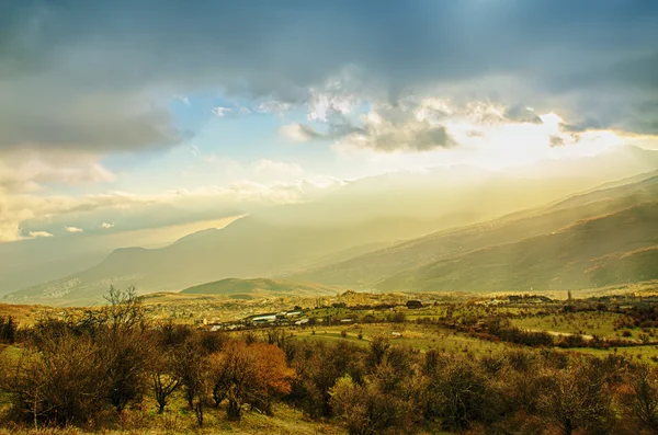 Rural landscape with sun rays — Stock Photo, Image