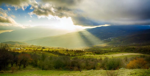 Rural landscape with sun rays — Stock Photo, Image