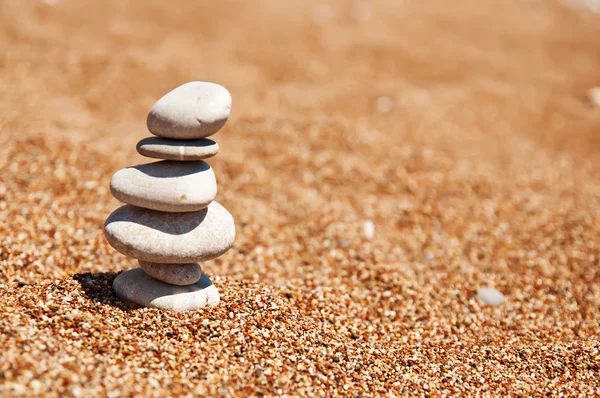 Cairn on the sand — Stock Photo, Image