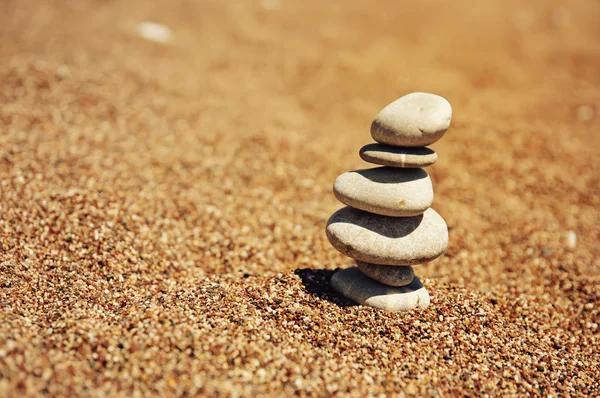 Cairn on the sand — Stock Photo, Image