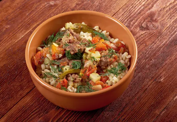 boiled pearl barley with meat and vegetable