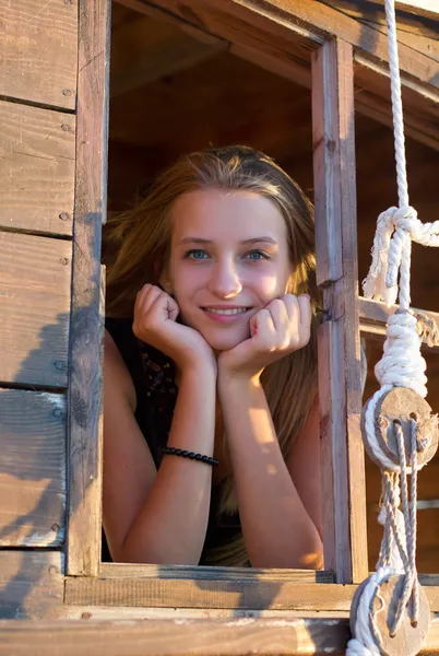 Girl in the window — Stock Photo, Image