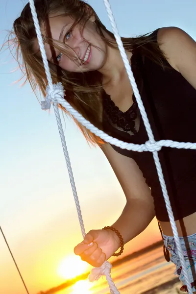 Smiling teen girl at sunset — Stock Photo, Image