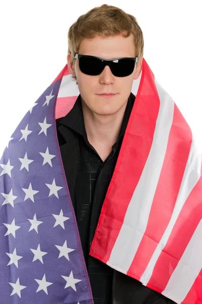 Joven en la bandera americana — Foto de Stock