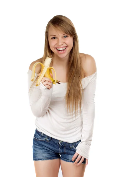 Smilende kvinne med banan i hånden – stockfoto