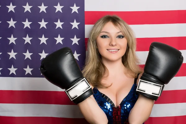 Smiling young blonde with boxing gloves Royalty Free Stock Photos