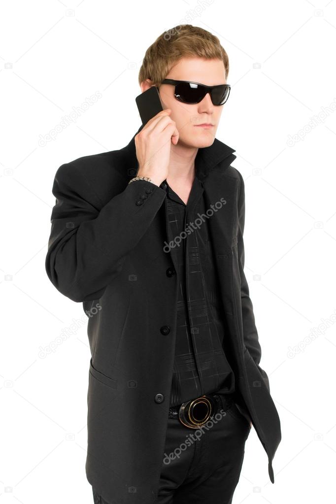 Man in sunglasses with a mobile