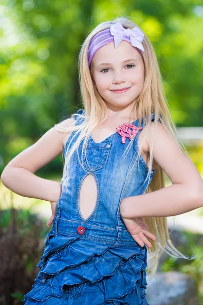 Little girl in jeans dress — Stock Photo, Image