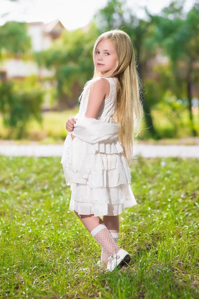 Little blond girl in white dress — Stock Photo, Image