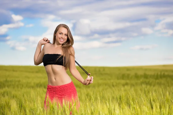 Cheerful young woman on the wheat field — Stock Photo, Image