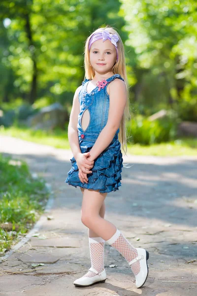 Little girl in jeans dress — Stock Photo, Image