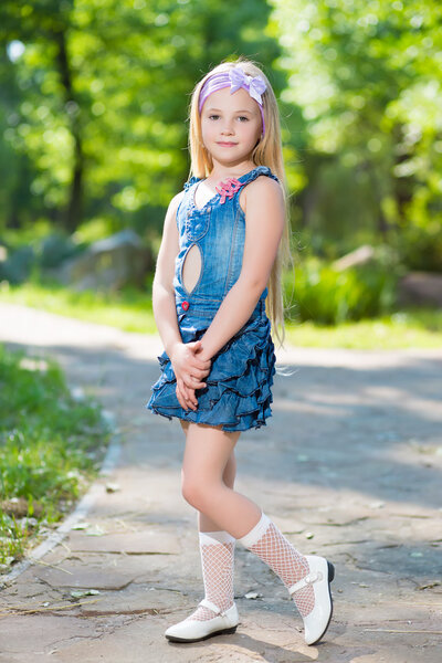 Little girl in jeans dress