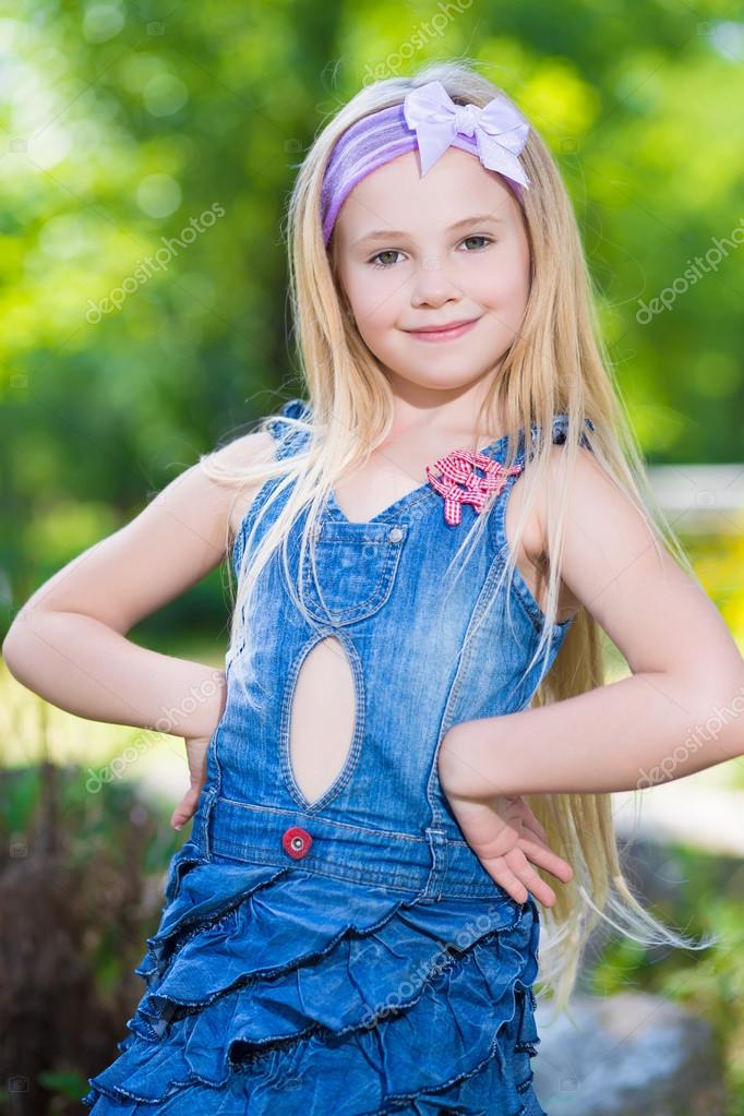 Little girl in jeans dress Stock Photo by ©acidgrey 49260577