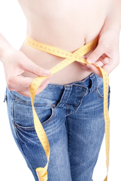Slender young Woman measuring herself — Stock Photo, Image