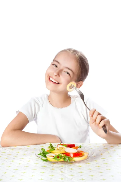 Young woman eating salad Stock Picture