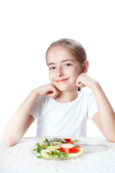 Young woman eating salad Stock Photo