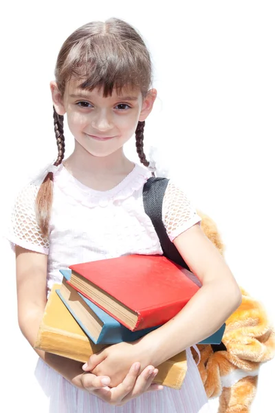 Дівчина школярка тримає книги — стокове фото