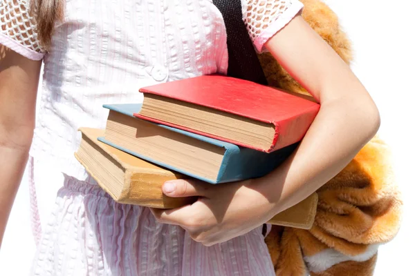 Menina estudante segurando livros — Fotografia de Stock