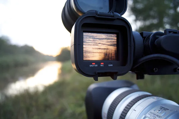 A videocamera filming river — Stock Photo, Image