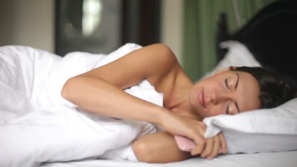 Portrait of a young girl sleeping on a pillow — Stock Video