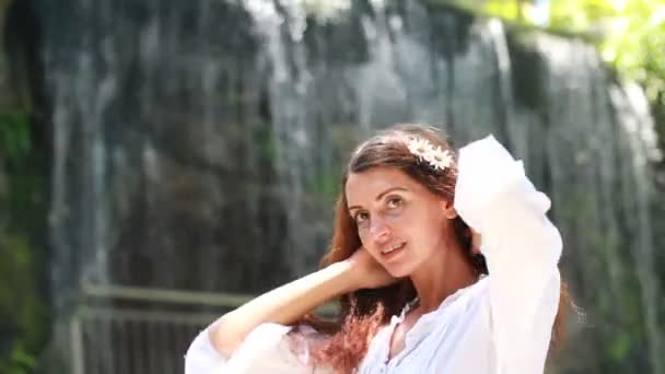 Young woman near waterfall — Stock Video