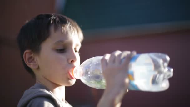 Boy drinks water — Stock Video