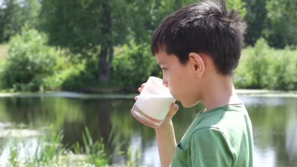 Boy drinks milk — Stock Video