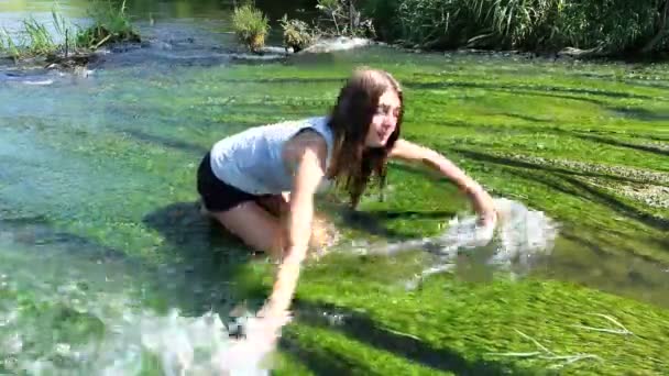 Young woman in stream — Stock Video