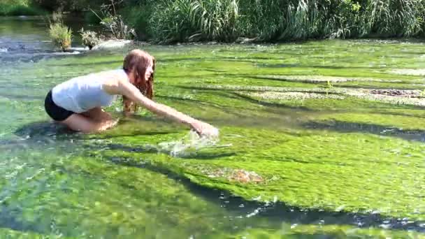 Young woman in stream — Stock Video