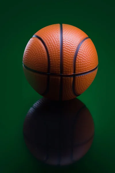 Bascketball on green background — Stock Photo, Image