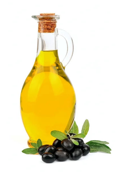 Een pot met olijfolie en sommige zwarte olijven — Stockfoto
