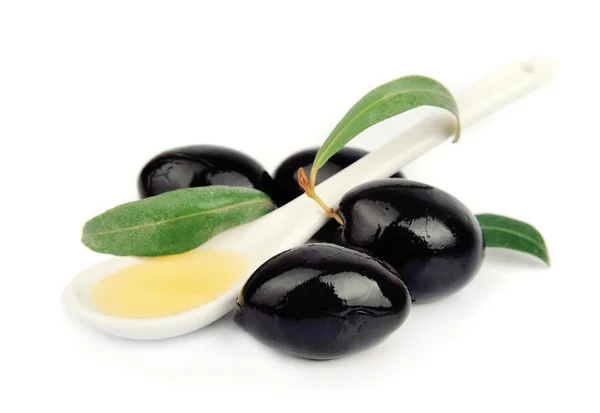 Olivy a lžíci oleje — Stock fotografie