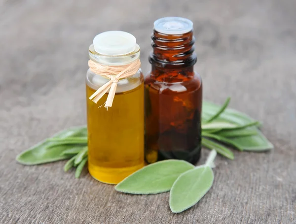 Oil of sage herbs and rasemary — Stock Photo, Image